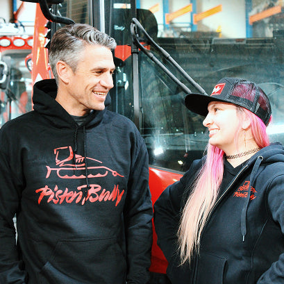 PistenBully sweatshirts and a flat brim hat. 
